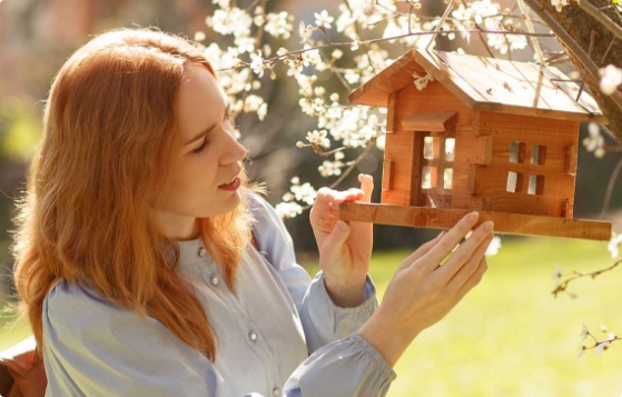 Woman with bird house